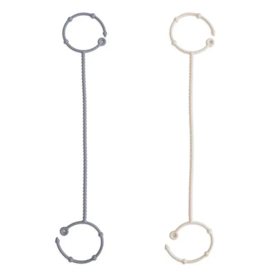 Adjustable silicone straps in Tradewinds (gray) and Shifting Sand (beige) colors, designed for versatile use.