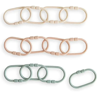 Mushie Chain Link Rings in Shifting Sand, Blush, and Cambridge Blue, showcasing soft silicone rings for playful activities.