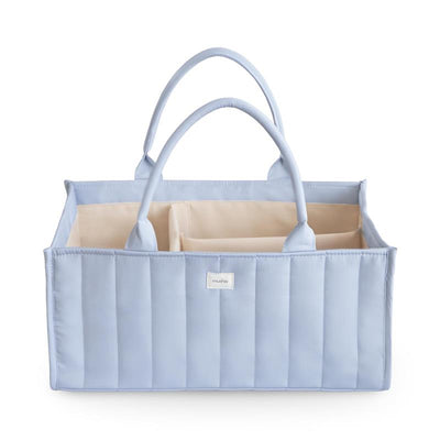 Light blue Mushie Baby Diaper Caddy with quilted design and multiple compartments for organizing newborn essentials.