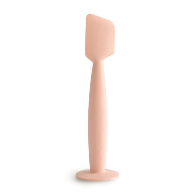Mushie Diaper Cream Applicator in blush color, designed for easy application of diaper cream with a flat, rounded tip.