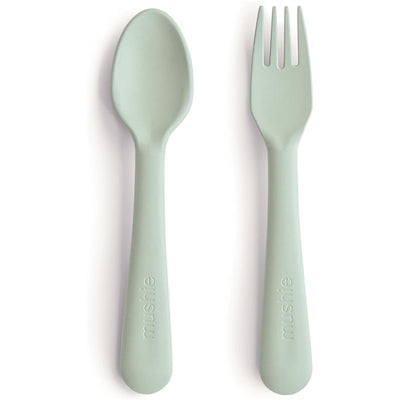 Sage-colored Mushie Dinnerware Fork and Spoon Set, featuring smooth, rounded handles and a minimalist design.