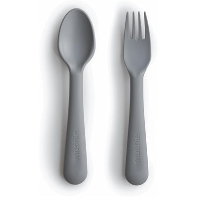 Mushie silicone fork and spoon set in smoke color, designed for children, featuring smooth rounded edges.