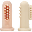 Two soft silicone finger toothbrushes in Shifting Sand and Blush colors, designed for gentle teeth and gum cleaning.