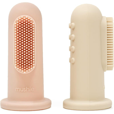 Two soft silicone finger toothbrushes in Shifting Sand and Blush colors, designed for gentle teeth and gum cleaning.