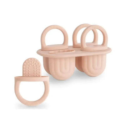 Mushie Silicone Toddler Ice Pop Tray in blush color, designed for making toddler-sized ice pops with easy-grip handles.