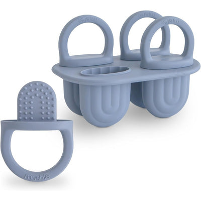 Mushie Silicone Toddler Ice Pop Tray in light blue, featuring three molds and a matching pop holder for easy grip.