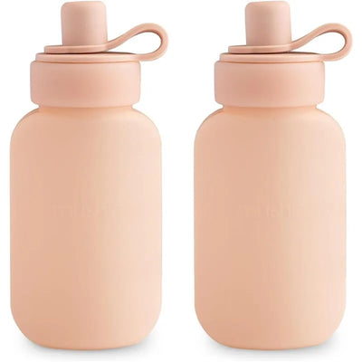 Mushie Puree Pouch in Blush color, featuring a soft silicone design and an easy-to-use screw cap.