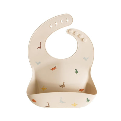 Silicone baby bib featuring colorful dinosaur designs, ideal for mealtime messes.
