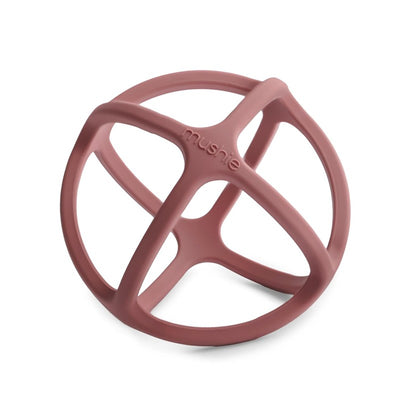 Mushie Silicone Ball Teether in a soft pink color with a multi-dimensional design, suitable for infants to chew and play with.