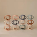 Mushie - Silicone Bottles Handles, Tradewinds/Shifting Sand Image 3