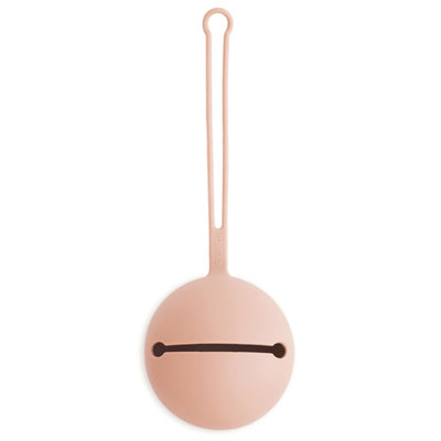 Blush silicone pacifier holder case featuring a rounded design with a strap for attachment and an opening for a pacifier.