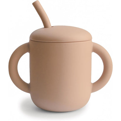 Silicone training cup with two handles and a straw, designed for easy use by toddlers. Color is natural beige.