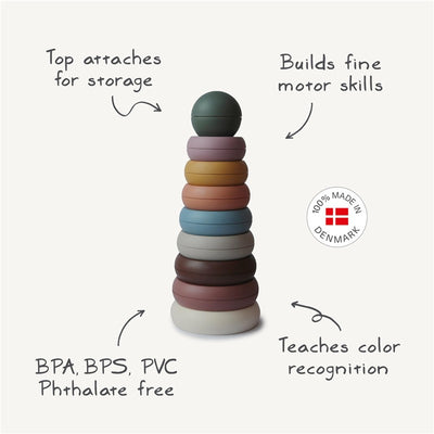 Mushie Stacking Rings in various colors designed for motor skill development and color recognition, made in Denmark.