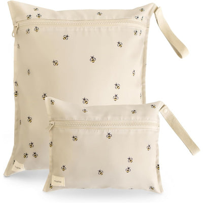 Two water-resistant wet bags from Mushie in a bees pattern, one large and one small, featuring zipper closures.
