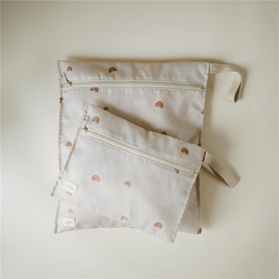 Water-resistant wet bags in a two-pack featuring a subtle rainbow pattern, one large and one small, with zippers.