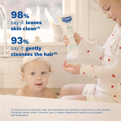 Mustela 2 in 1 Cleansing Gel bottle held by a child, with another child bathing nearby. Claims on effectiveness visible.