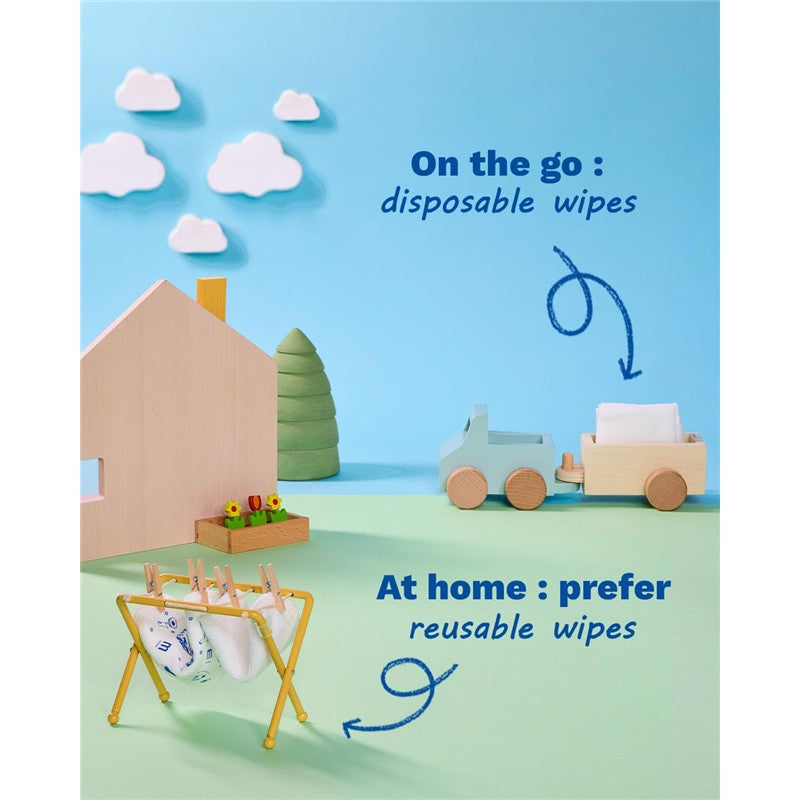 Mustela compostable cleansing water wipes packaging with a playfully arranged background showing disposable and reusable options.
