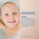 Gentle shampoo bottle next to a smiling child in a bath, highlighting its natural ingredients and suitability for delicate hair.