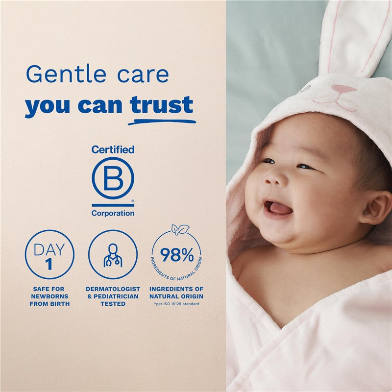 Mustela No-Rinse Cleansing Water, featuring a smiling baby wrapped in a bunny hooded towel, emphasizes gentle care and natural ingredients.