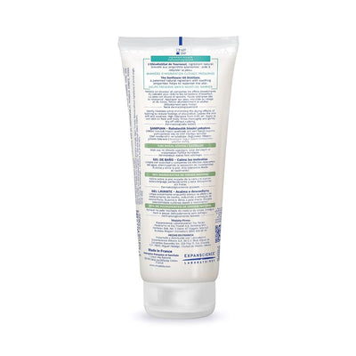Mustela Stelatopia Cleansing Gel in a plastic tube, 6.76 fl oz, with green and blue text detailing its cleansing properties and ingredients.