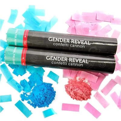 Two gender reveal confetti cannons with a black design, surrounded by pink and blue confetti and colored powder.
