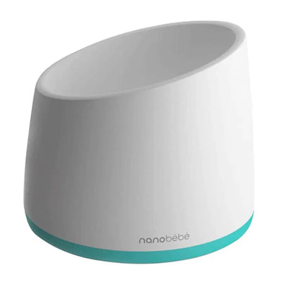 Teal Nanobebe breastmilk bottle warming bowl with a rounded design and a white body, ideal for warming baby bottles.