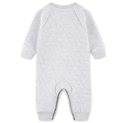 Kids coverall in birch heather color, featuring a quilted texture, long sleeves, and a round neckline.