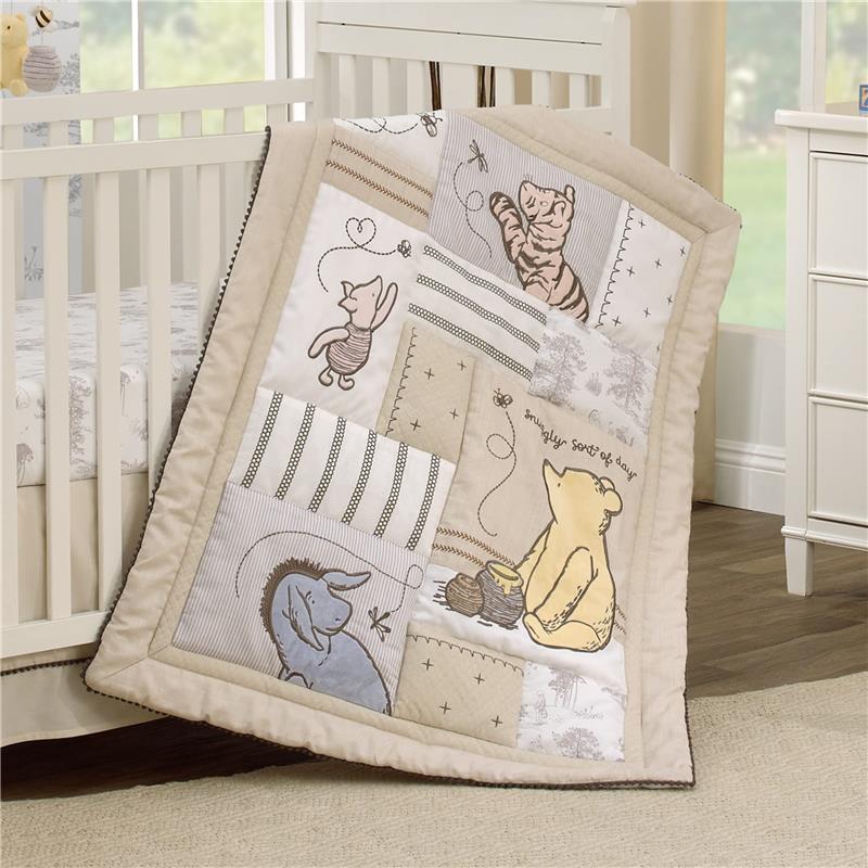 Taupe nursery crib bedding set featuring Winnie the Pooh, Piglet, and Eeyore in patchwork design.