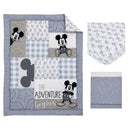 Mickey Mouse themed nursery crib bedding set featuring a quilt with patches, a fitted sheet, and a bed skirt.