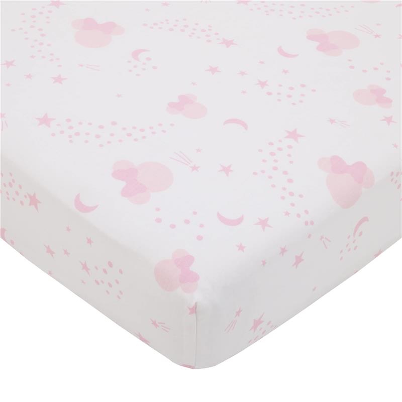 Crib sheet featuring a pink and white pattern with Minnie Mouse, stars, moons, and playful dots.