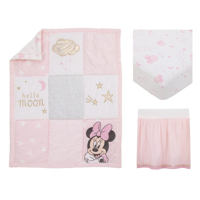 Crib bedding set featuring a quilt with Minnie Mouse, stars, and clouds, along with a fitted sheet and bed skirt.
