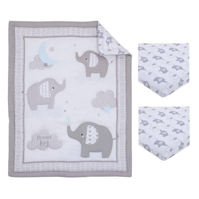 Mini crib bedding set featuring gray elephants, clouds, and stars, with a quilt and two coordinating fitted sheets.
