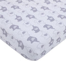 Mini crib bedding set featuring a playful design of gray and white elephants on a soft background.