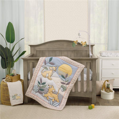 Lion King-themed nursery crib bedding set featuring a quilt with Simba designs, a mobile, and a cozy, stylish environment.