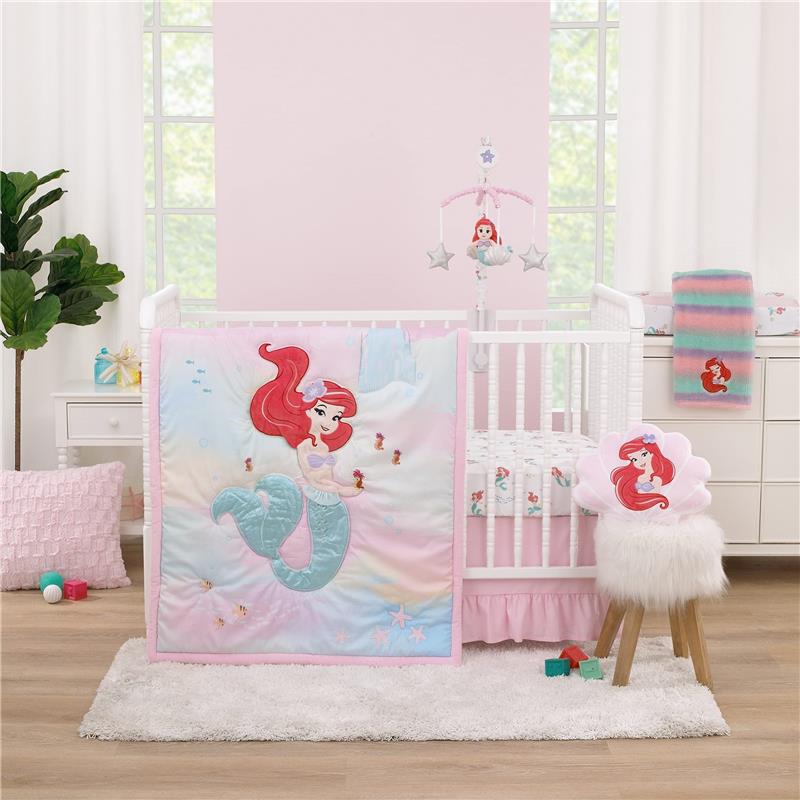NoJo Disney Ariel Watercolor Wishes musical mobile above a crib, featuring an Ariel-themed quilt and accessories.