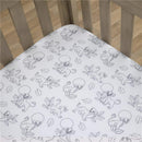 Super soft fitted crib sheet featuring Lion King characters and leafy designs, perfect for a nursery.