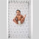Super soft fitted crib sheet featuring Disney Lion King characters, with a baby lying happily in a crib.