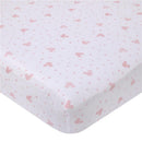Fitted crib sheet featuring a white background with pink Minnie Mouse icons and polka dots, designed for a nursery.