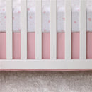 Fitted crib sheet featuring a white background with pink Minnie Mouse icons and polka dots, set on a pink crib with white slats.