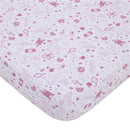 Fitted crib sheet featuring NoJo Disney Princess designs with castles, hearts, stars, and princess silhouettes in pink.