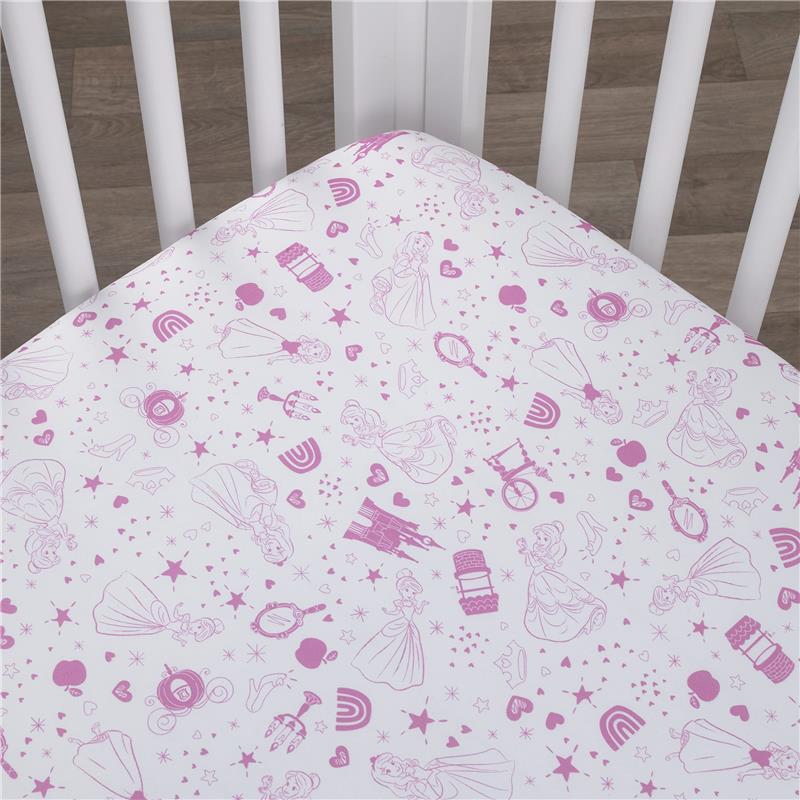 Fitted crib sheet featuring pink and white designs of Disney princesses, hearts, stars, and castles, perfect for nursery decor.