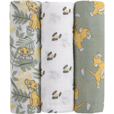 Three printed muslin swaddles featuring Lion King characters: one with Simba among leaves, a plain white, and one with playful Simba on green.