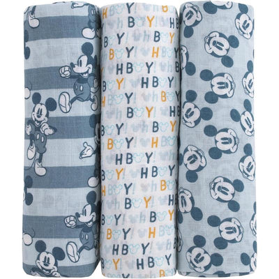 Three printed muslin swaddles featuring Mickey Mouse designs in blue and white, including patterns with stripes and text.