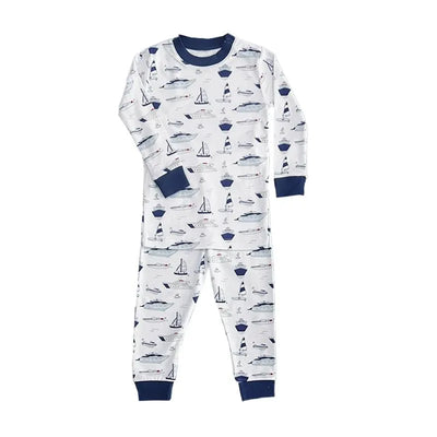 Long sleeve pajamas for baby boys featuring a nautical print with boats and sailboats in blue and white.