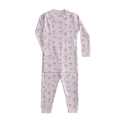 Long sleeve pink pajama set for baby girls featuring a pattern of bows, made by Noomie.