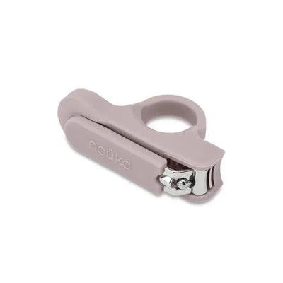 Baby nail clipper in soft pink with a built-in safety feature, designed for easy and safe nail trimming.