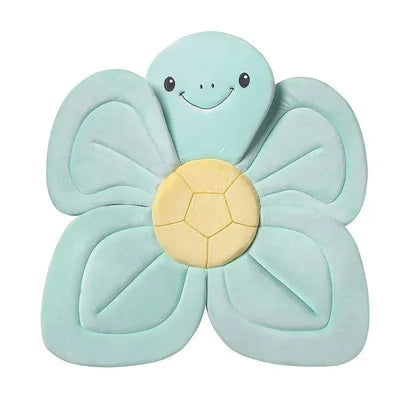 Nuby Bathing Turtle baby bath sink insert features a soft turtle design with flower-shaped edges and a smiling face.