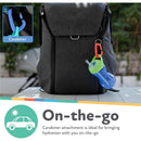 Nuby Clik-It Flexi Straw Cup hanging from a backpack with a carabiner, highlighting its portability for on-the-go use.