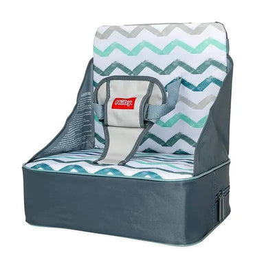 Collapsible Nuby booster seat with gray fabric exterior and chevron-patterned padded seat, includes safety straps.