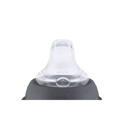 Nuk Disney Toy Story learner cup with a transparent spout and dark gray base, designed for boys, 10 oz capacity.